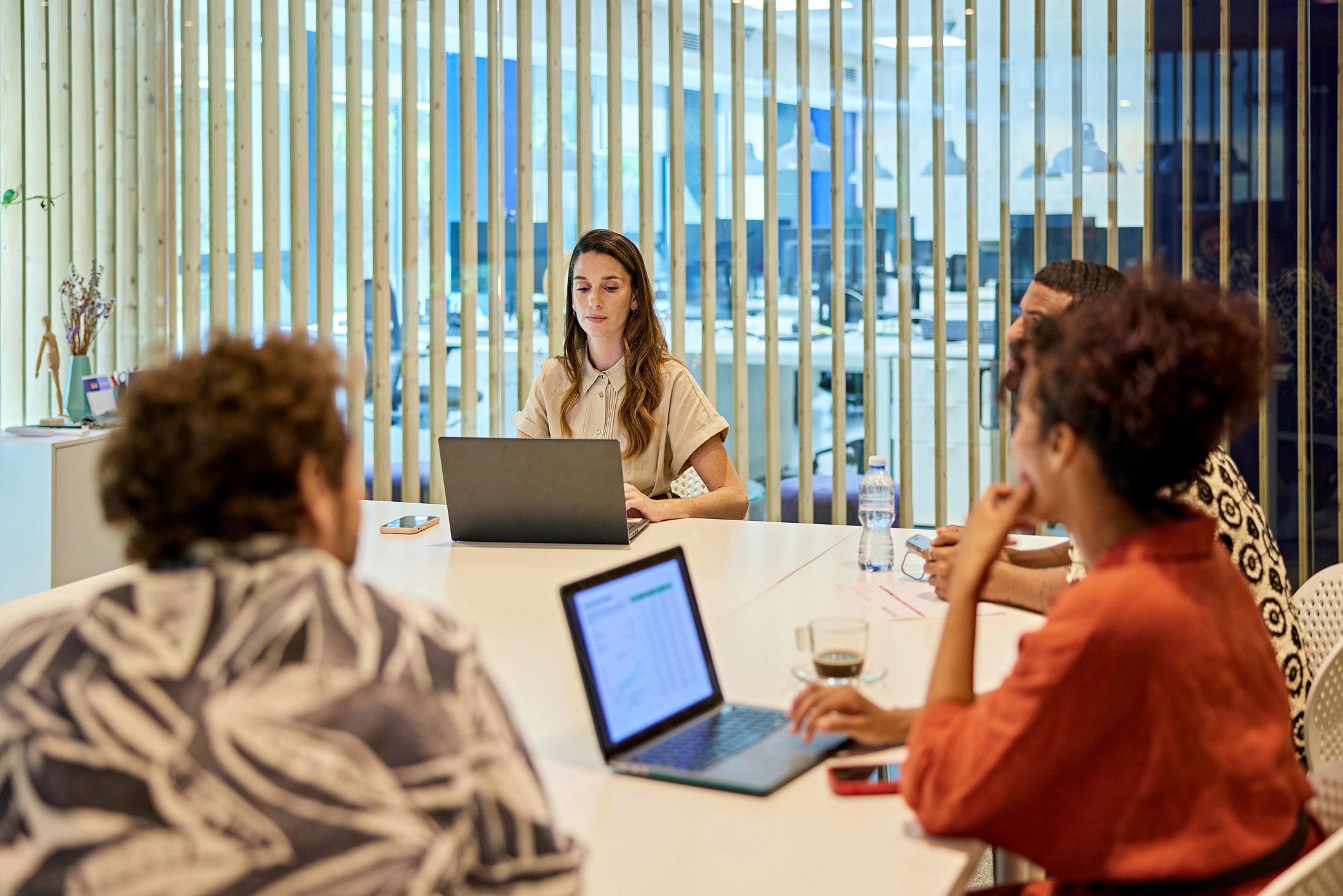 Marketing team meeting around a table planning next steps