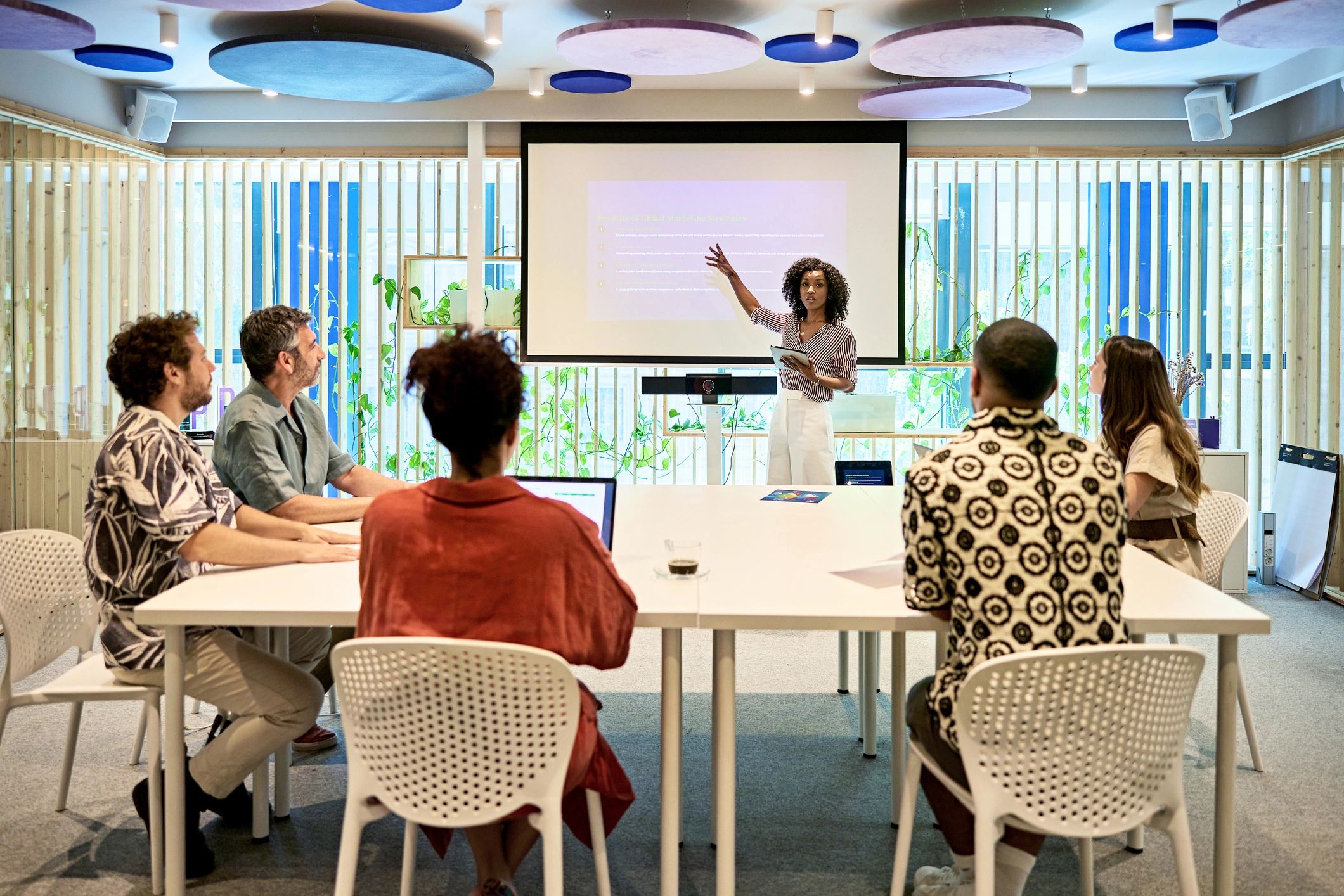 Businesswoman giving onsite presentation to project team